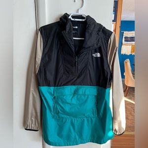 The north face windbreaker that folds up into a Fanny pack for easy carrying